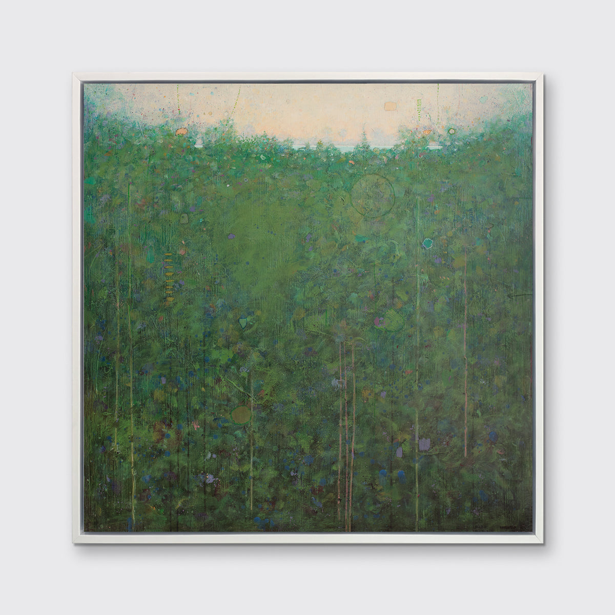 A green abstract landscape print in a white floater frame hangs on a white wall.