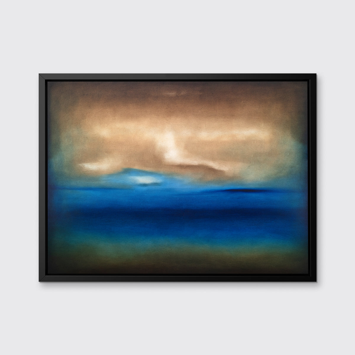 A dark brown, blue, white and teal abstract landscape print in a black floater frame hangs on a white wall.