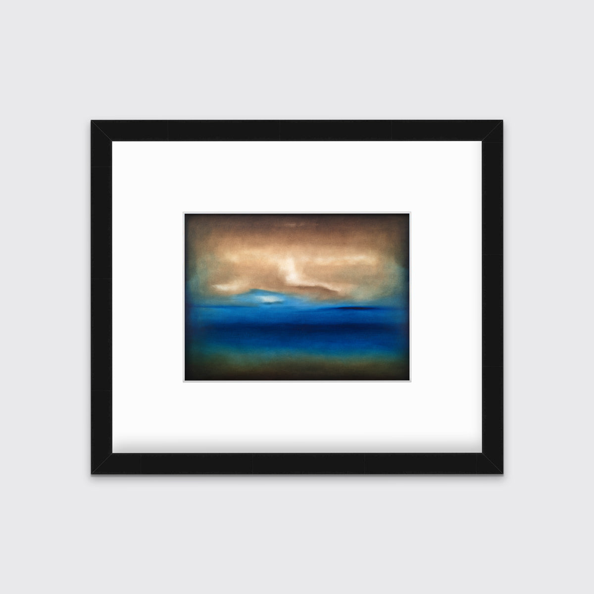 A dark brown, blue, white and teal abstract landscape print in a black frame with a mat hangs on a white wall.