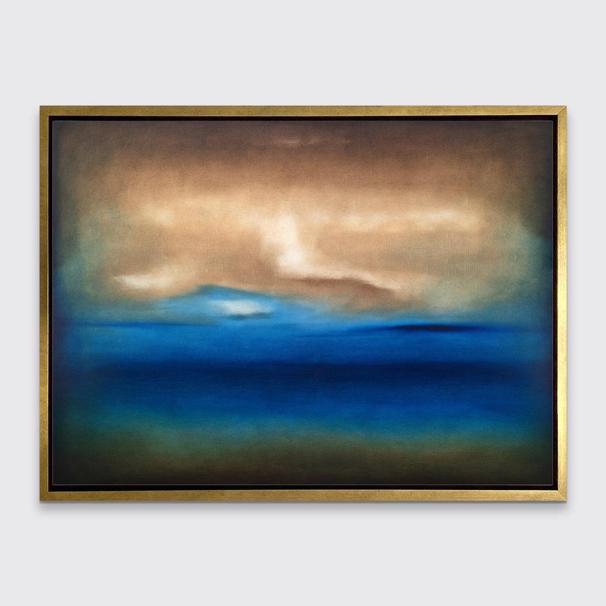 A dark brown, blue, white and teal abstract landscape print in a gold floater frame hangs on a white wall.