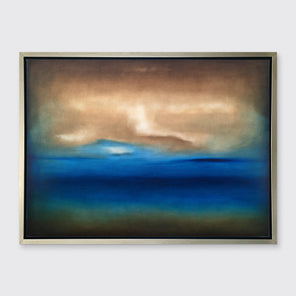A dark brown, blue, white and teal abstract landscape print in a silver floater frame hangs on a white wall.