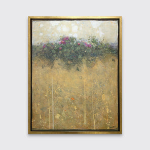 A dark yellow, green and beige abstract landscape print in a gold floater frame hangs on a white wall.