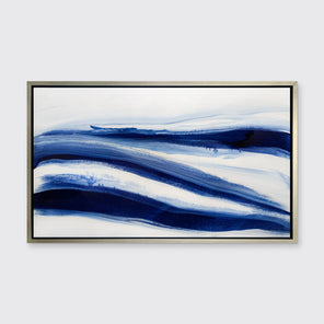 A dark blue and white abstract print in a silver floater frame hangs on a white wall.