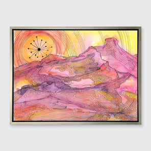 A pink, yellow and orange abstract landscape print with black outlines in a silver floater frame hangs on a white wall.
