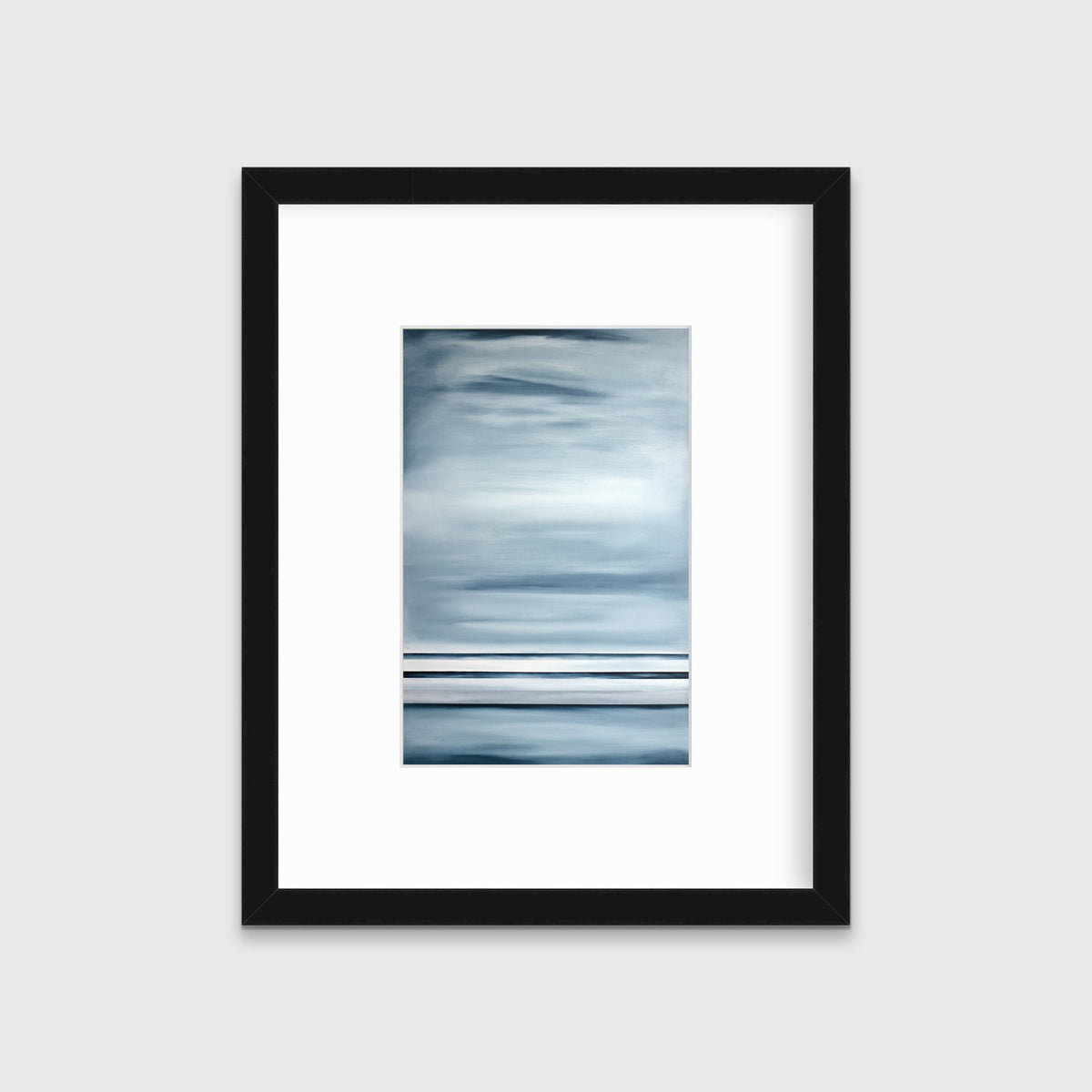 Blue and white linear abstract print in a black frame with a mat on a white wall.