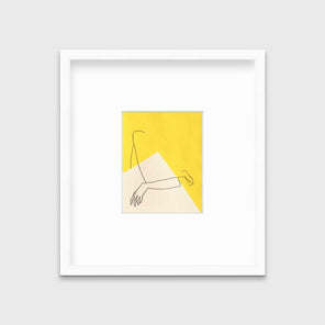 A yellow and white abstract print by Hazal Ozturk in a white frame with a mat hangs on a white wall.