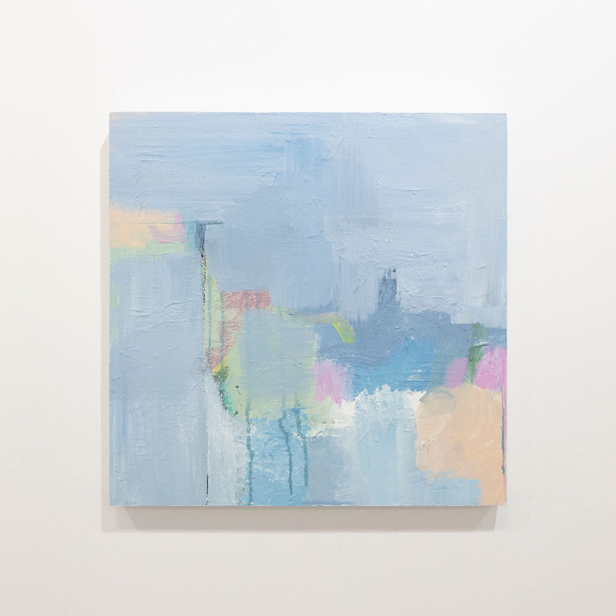 An abstract painting with blue, pink, green and orange patches is hung on a gallery wall. Wired and ready to hang.