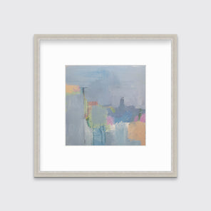 A slate blue, green, light orange and pink abstract print in a silver frame with a mat hangs on a white wall.