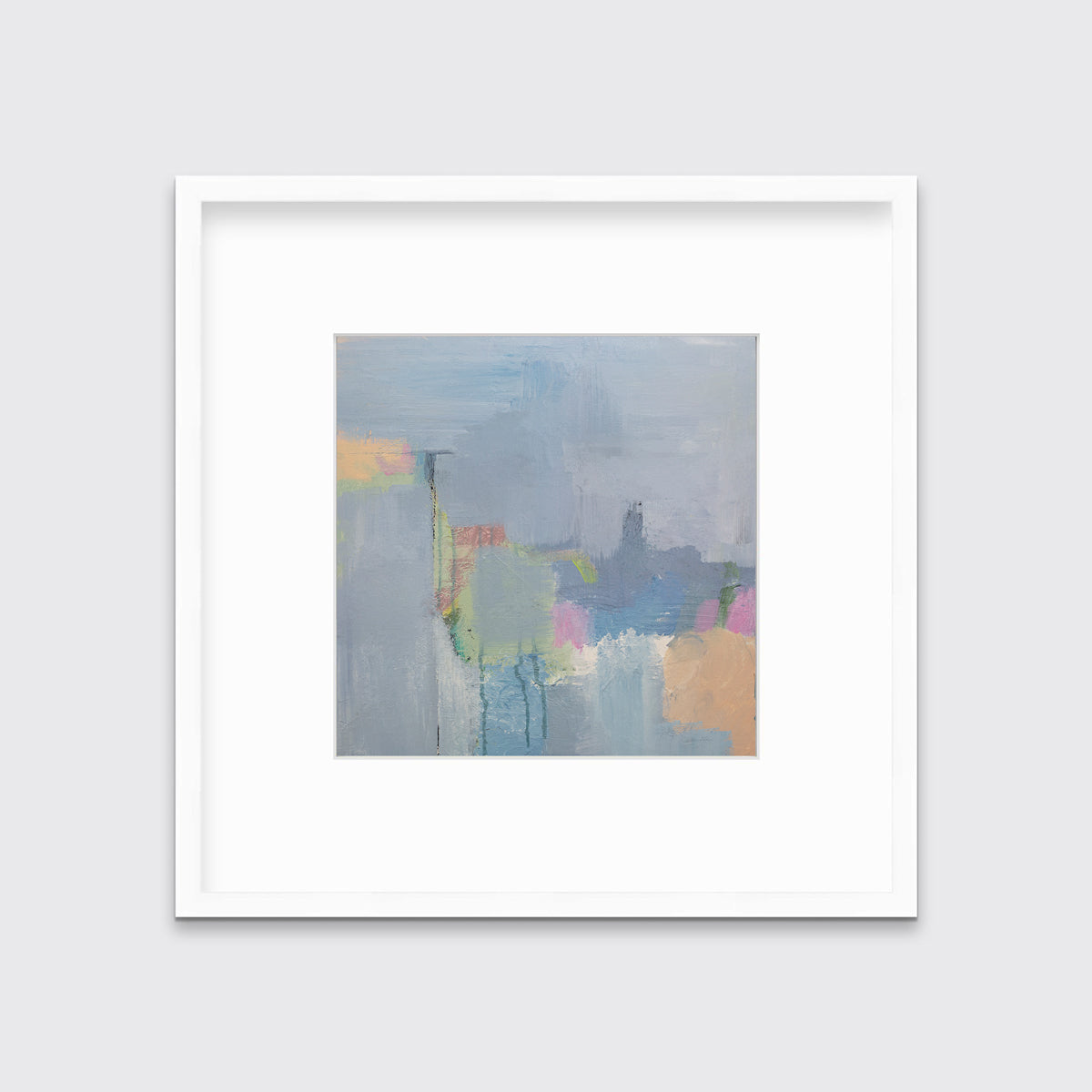 A slate blue, green, light orange and pink abstract print in a white frame with a mat hangs on a white wall.