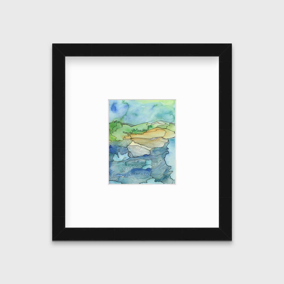 A blue and green landscape illustration in a black frame with a mat hangs on a grey wall.