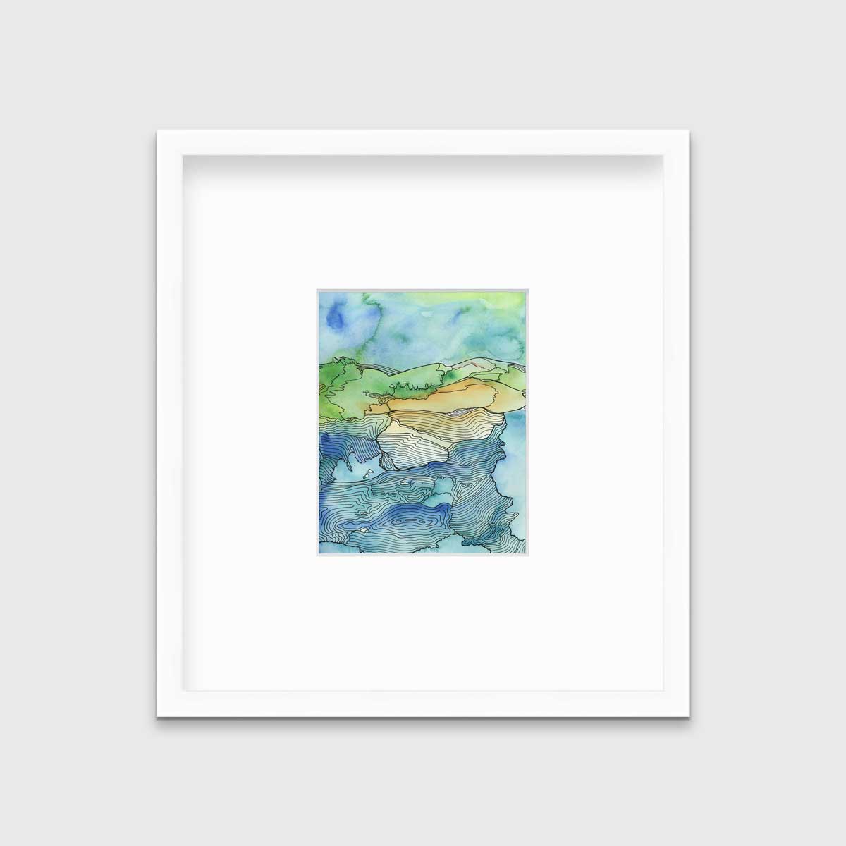 A blue and green landscape illustration in a white frame with a mat hangs on a grey wall.
