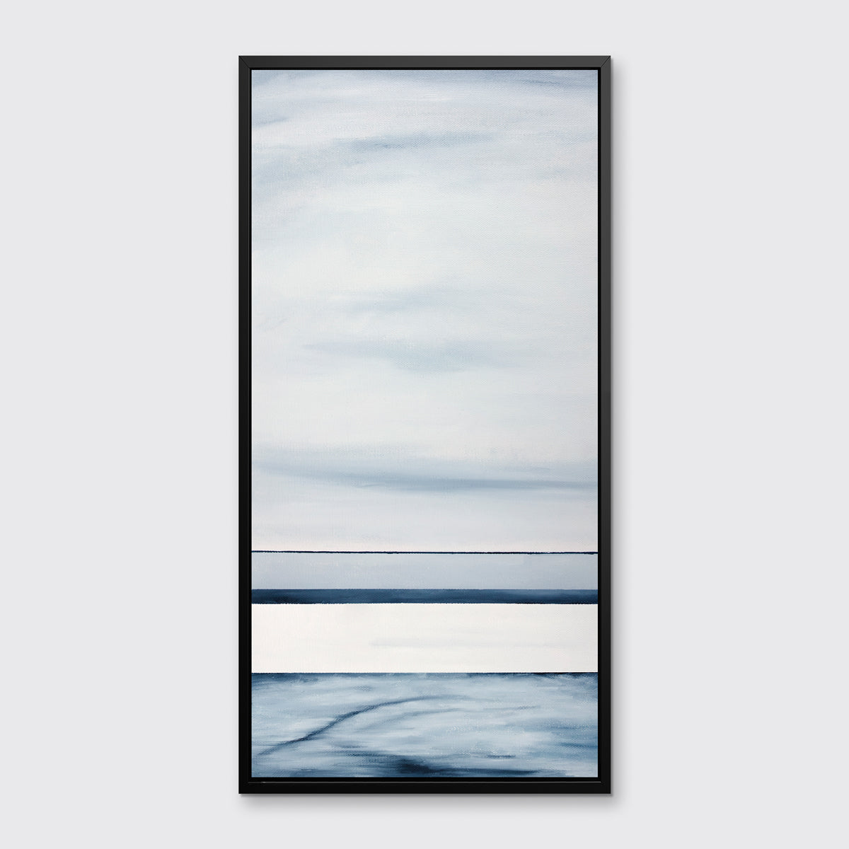 A blue and white abstract print in a black floater frame hangs on a white wall.