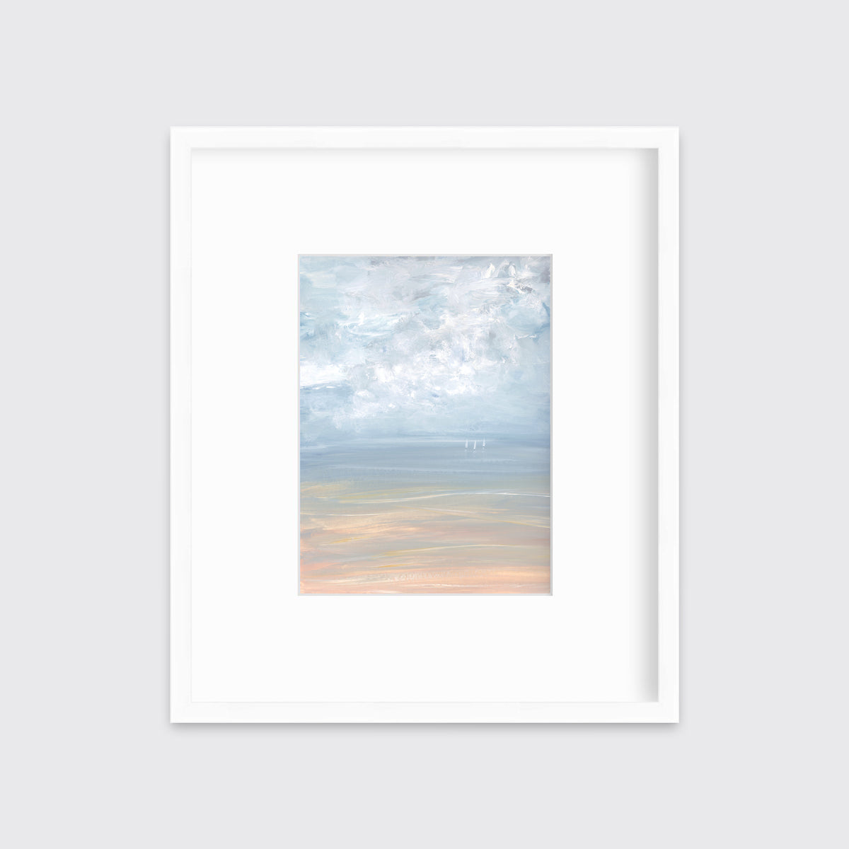 A white, blue and beige abstract seascape print in a white frame with a mat hangs on a white wall.