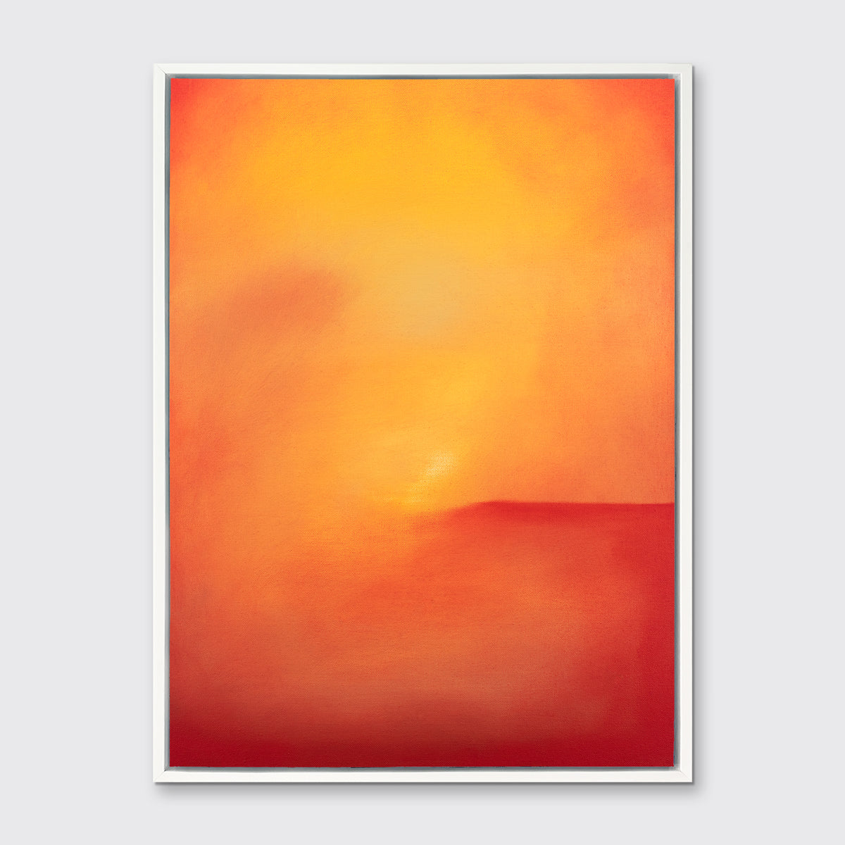 An orange and red abstract print in a white floater frame hangs on a white wall.