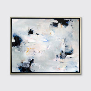 A white, black and grey abstract print in a silver floater frame hangs on a white wall.