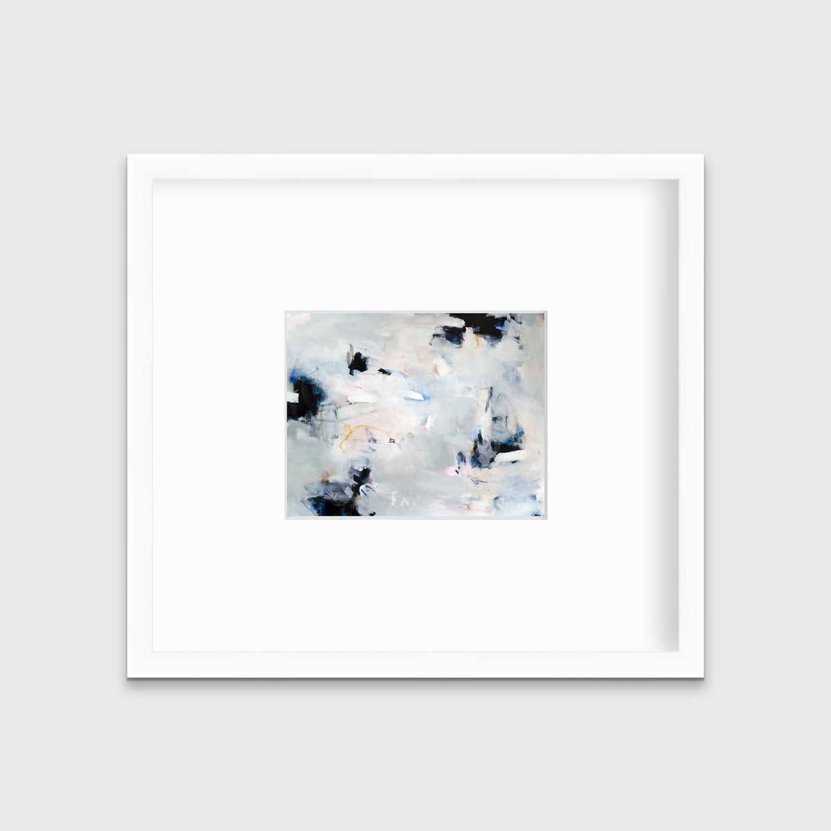 A black and white abstract print by Kelly Rossetti hangs in a white frame with a mat on a white wall.