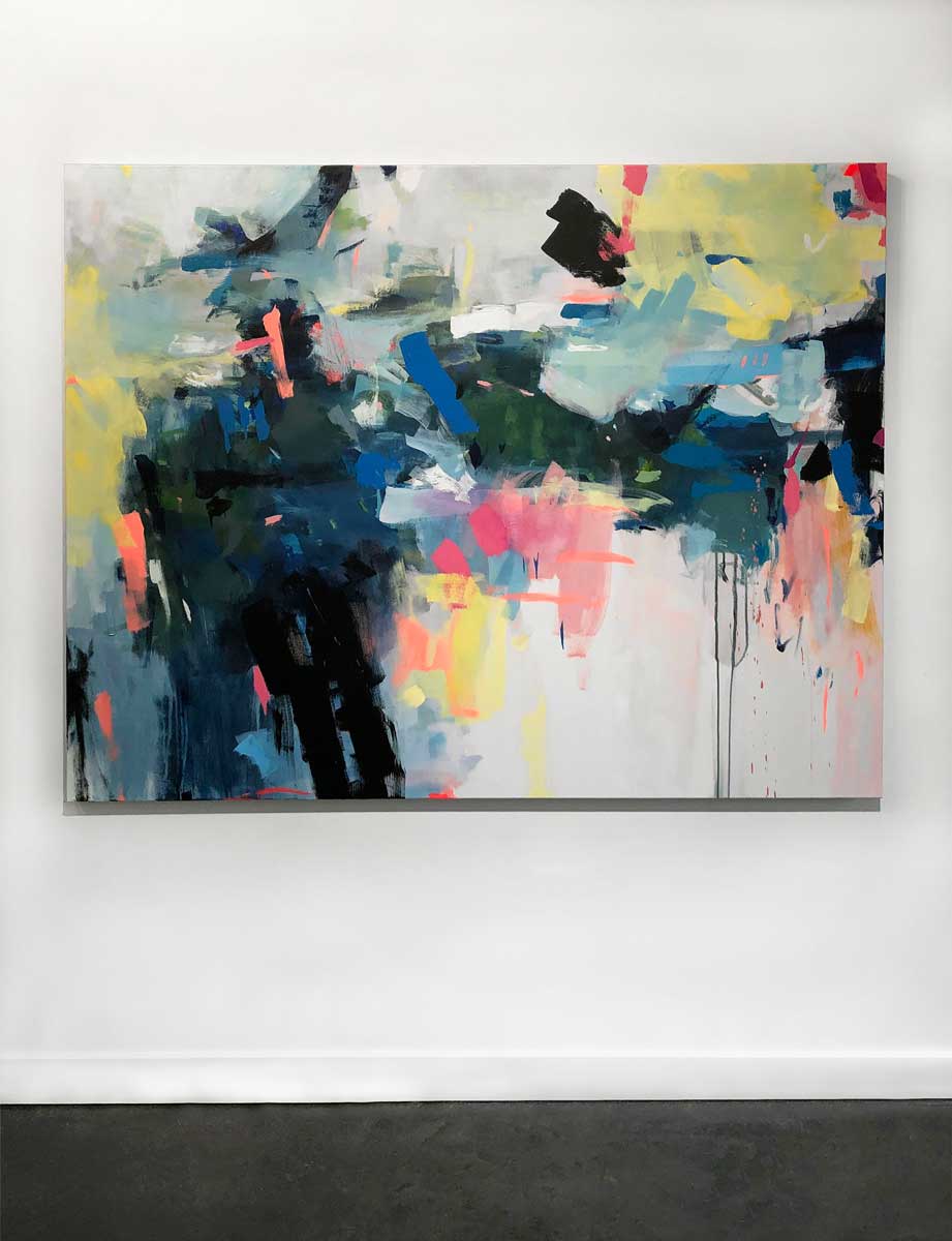 A blue and yellow colorful abstract painting by Kelly Rossetti hangs on a white wall.