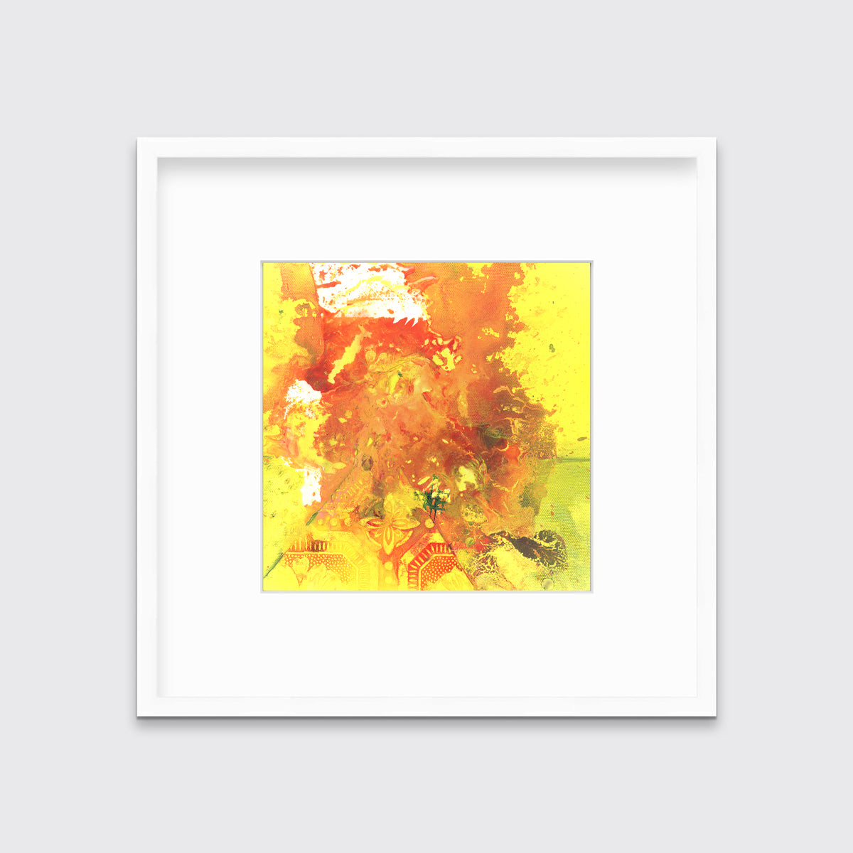 A yellow, orange and white abstract print in a white frame with a mat hangs on a white wall.