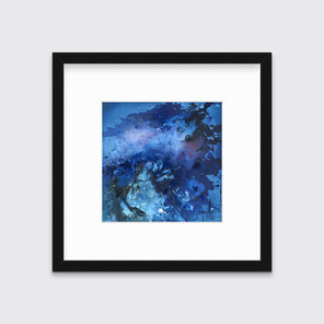 A blue and black abstract print in a black frame with a mat hangs on a white wall.