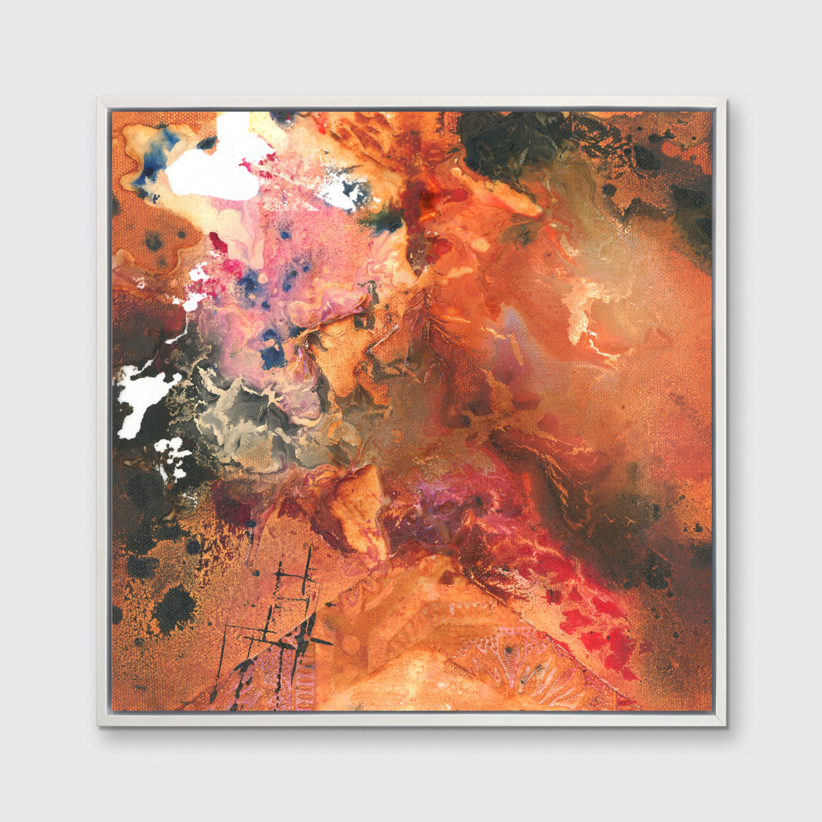 A red, orange, black and pink abstract print in a white floater frame hangs on a white wall.