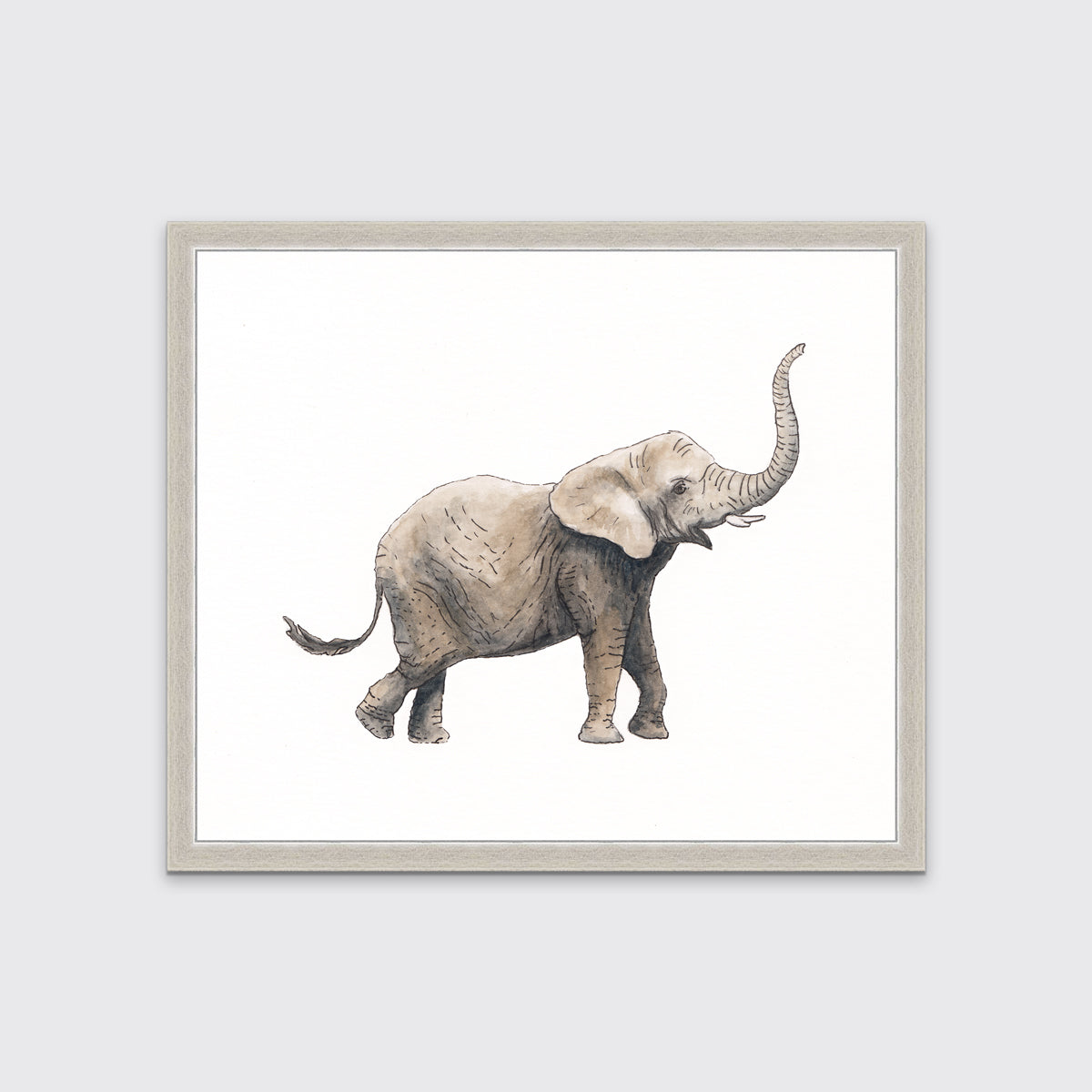 An elephant print in a unmatted silver frame hangs on a white wall.