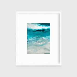 A teal, white and grey abstract print in a white frame with a mat hangs on a white wall.