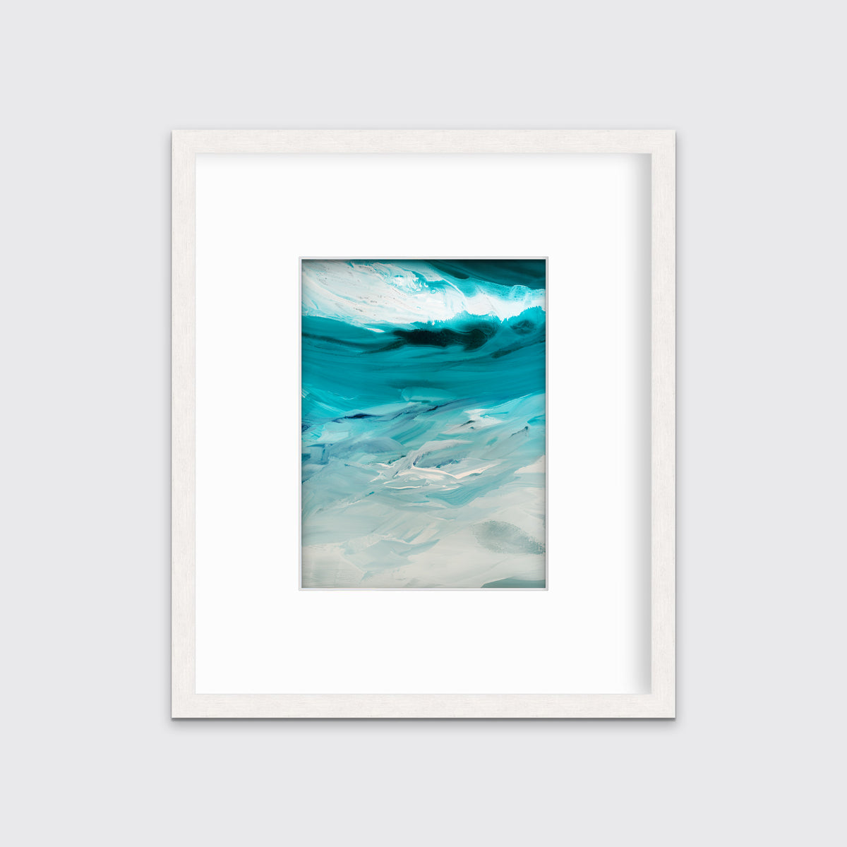 A teal, white and grey abstract print in a white frame with a mat hangs on a white wall.
