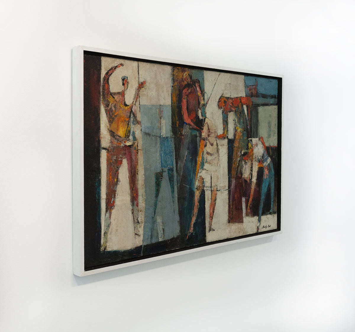 A multicolored abstract figurative painting by Stanley Bate in a white frame is seen at an angle. The painting is wired and ready to hang.