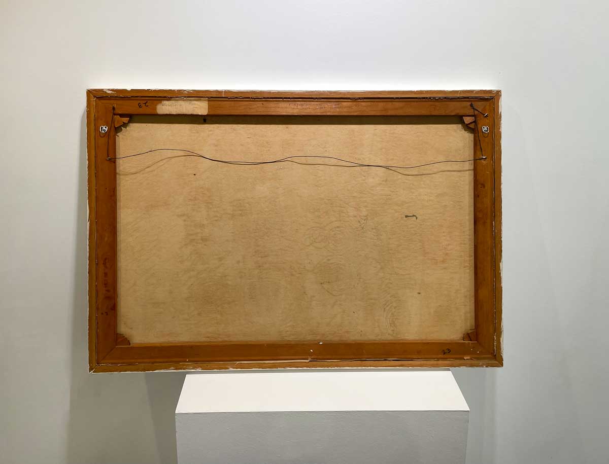 The back of the painting with the title and the wire for hanging.