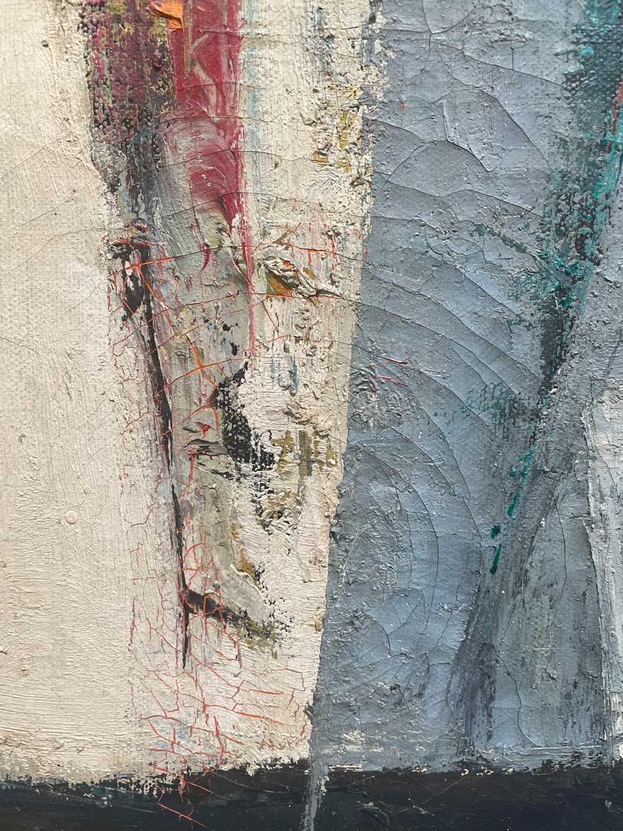 A close up of the texture of the white, blue and red paint.