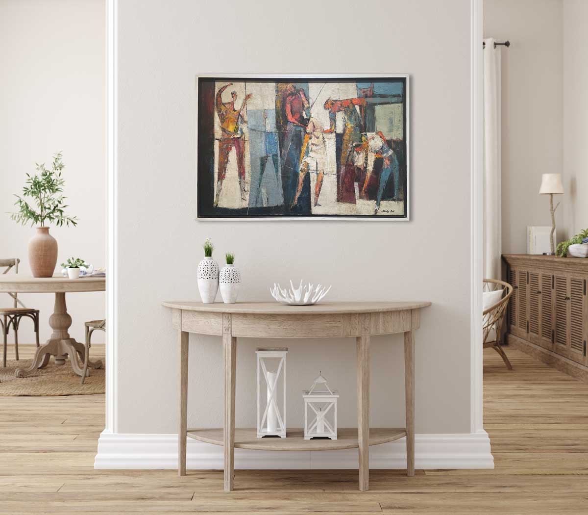 A multicolored abstract figurative painting in a white floater frame hangs on a light grey wall above a natural wood half circle console table with two white vases, a white decorative bowl and two different size white lanterns. 