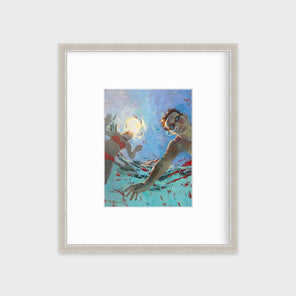 A figurative print of two kids underwater in a silver frame with a mat hangs on a white wall.