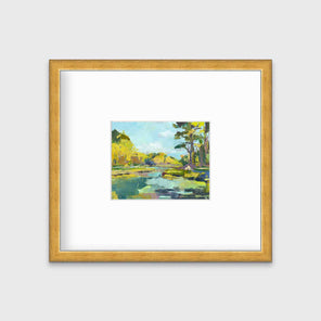A chartreuse, light blue and green abstract landscape print in a gold frame with a mat hangs on a white wall.