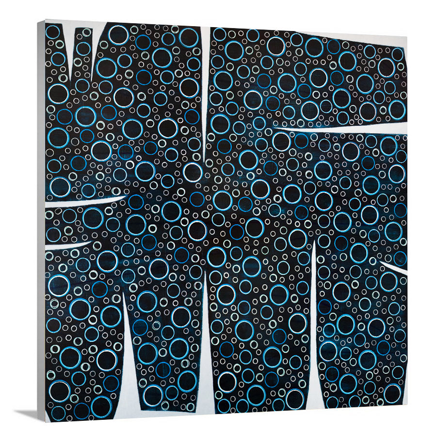 A side-angle view of a black, blue and white abstract print on canvas.