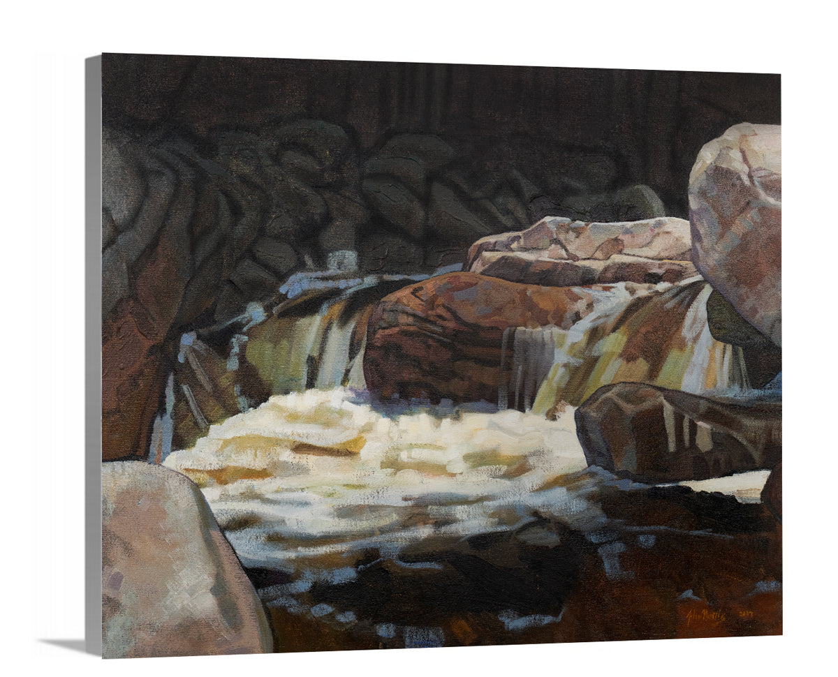 A side-angle view of a brown, black and white abstract river landscape print on canvas.