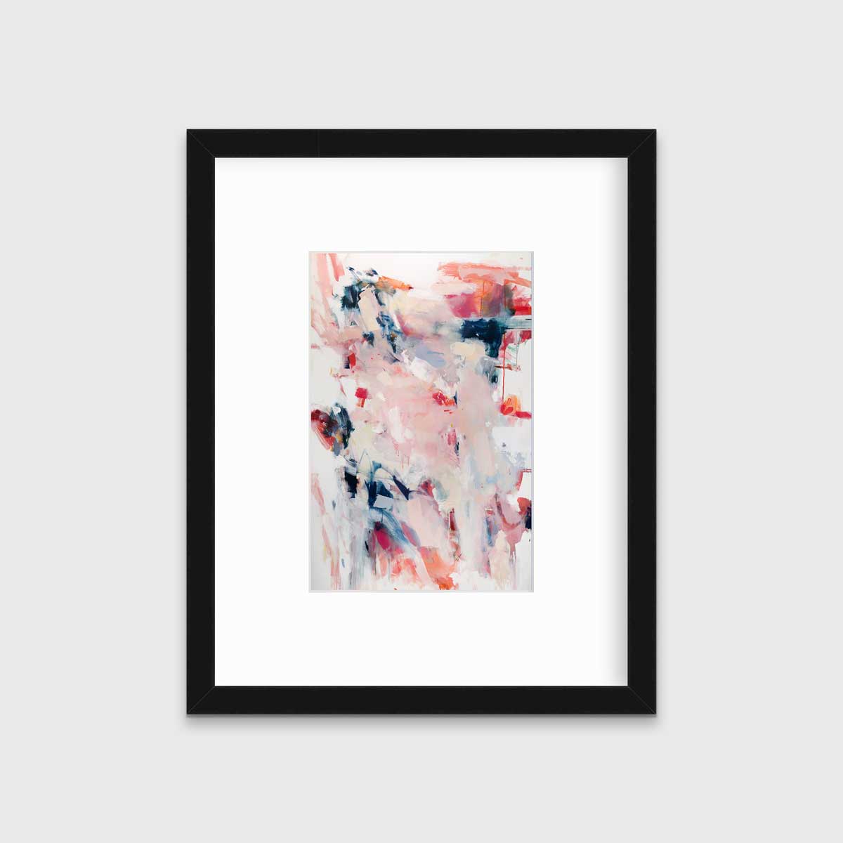 A pink and white abstract print by Kelly Rossetti in a black frame with a mat hangs on a white wall.