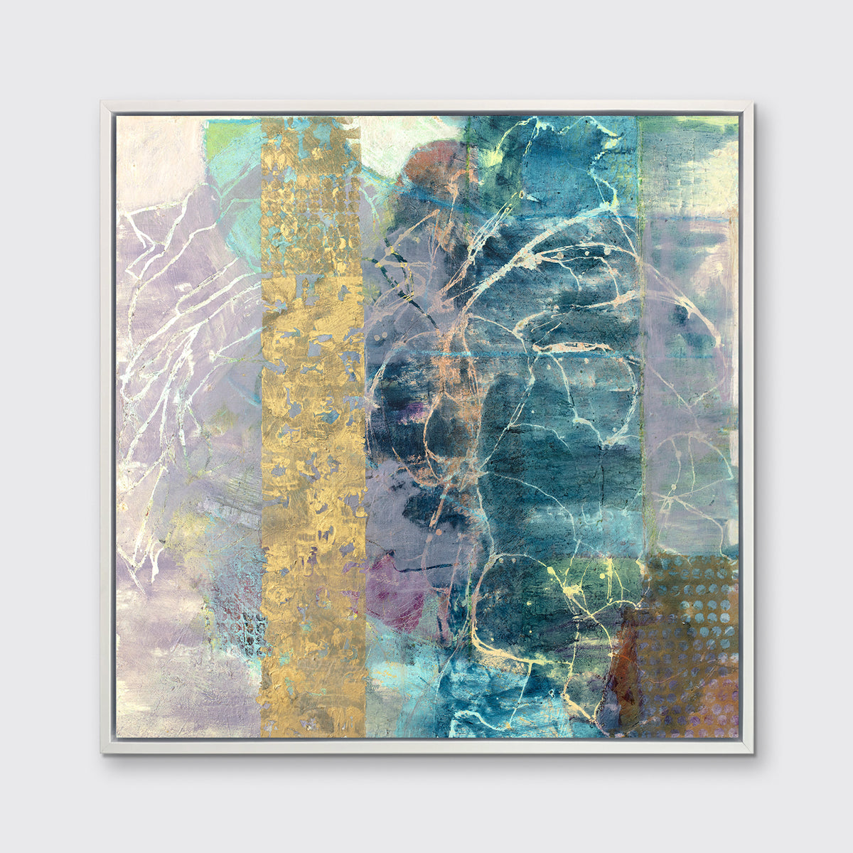 A blue, purple and gold abstract print in a white floater frame hangs on a white wall.