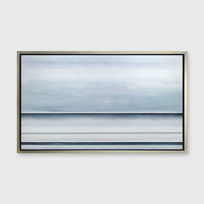 A tonal blue abstract landscape print in a silver floater frame hangs on a white wall.