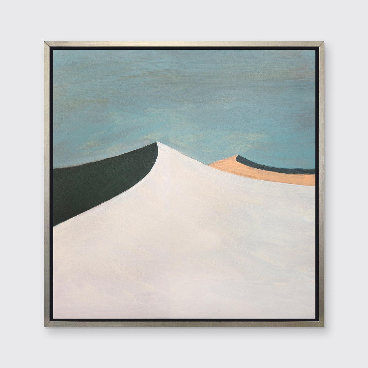 A blue, white, peach and dark teal abstract landscape print in a silver floater frame hangs on a white wall.