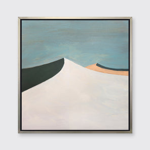 A blue, white, peach and dark teal abstract landscape print in a silver floater frame hangs on a white wall.