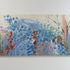 An encaustic painting with expressionistic floral motifs in red and blue is hung on a gallery wall. Wired and ready to hang.