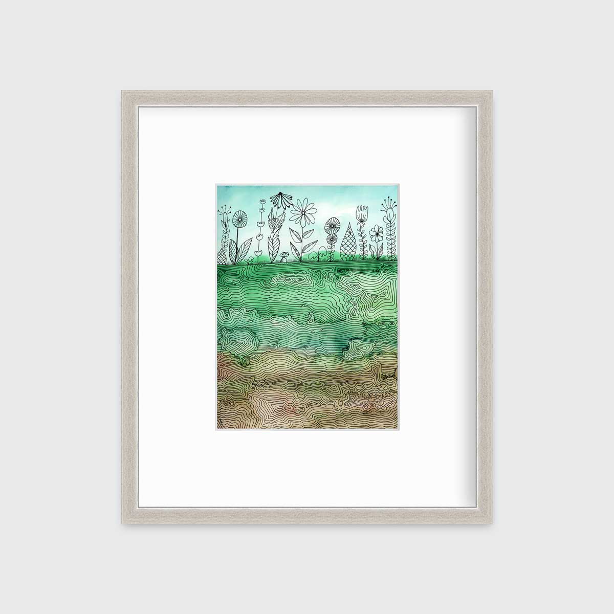 A green, light blue and brown botanical illustration print in a silver frame with a mat hangs on a white wall.