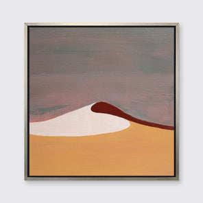 A mauve, burnt yellow, red and white abstract landscape print in a silver floater frame hangs on a white wall.