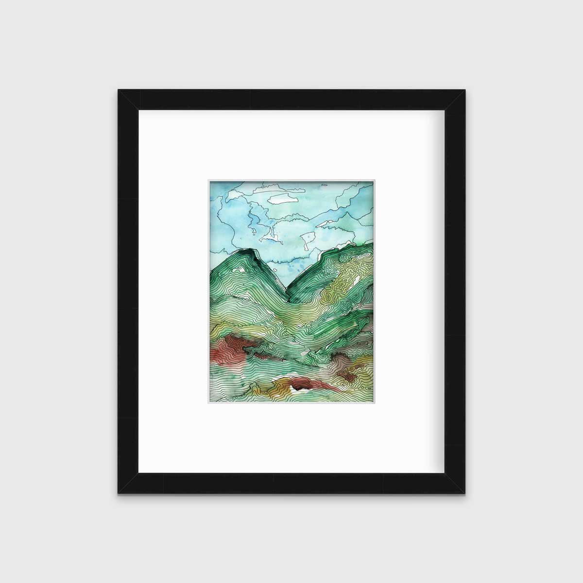 A blue, green and black abstract landscape print in a black frame with a mat hangs on a white wall.