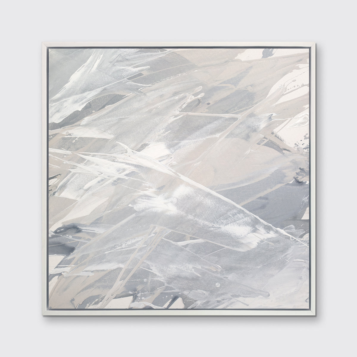 A grey, beige and white abstract print in a white floater frame hangs on a white wall.