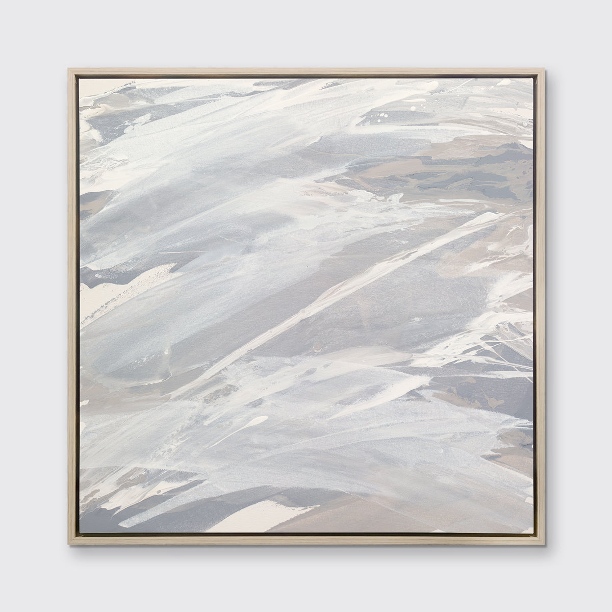A grey, beige and white abstract print in a white oak wood floater frame hangs on a white wall.