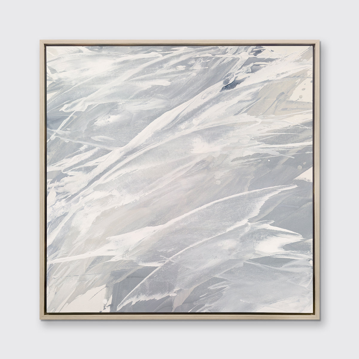 A grey, beige and white abstract print in a white oak wood floater frame hangs on a white wall.