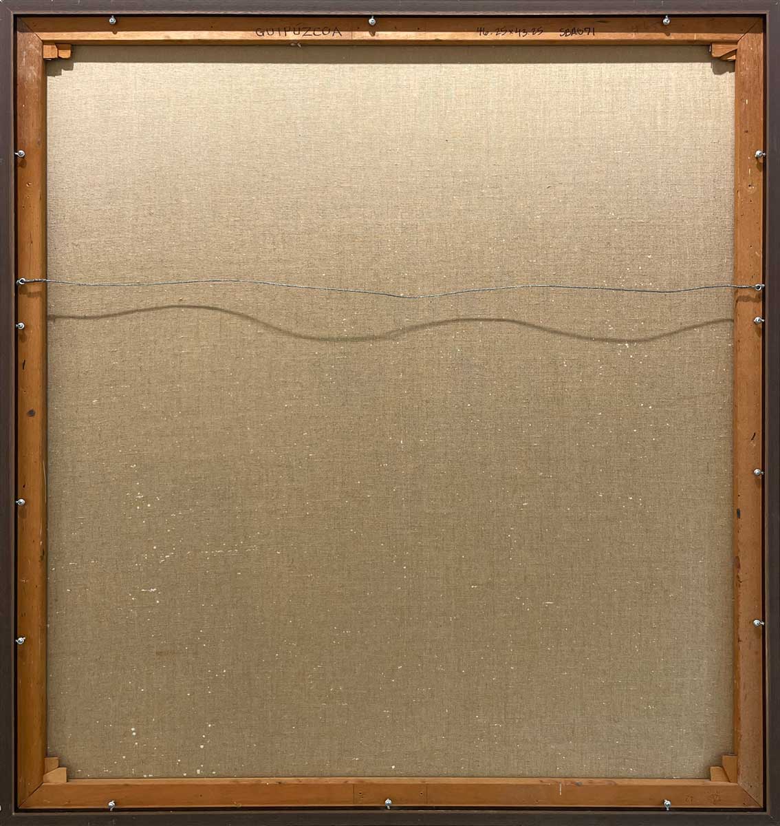 The back of the painting with the title and hanging wire.
