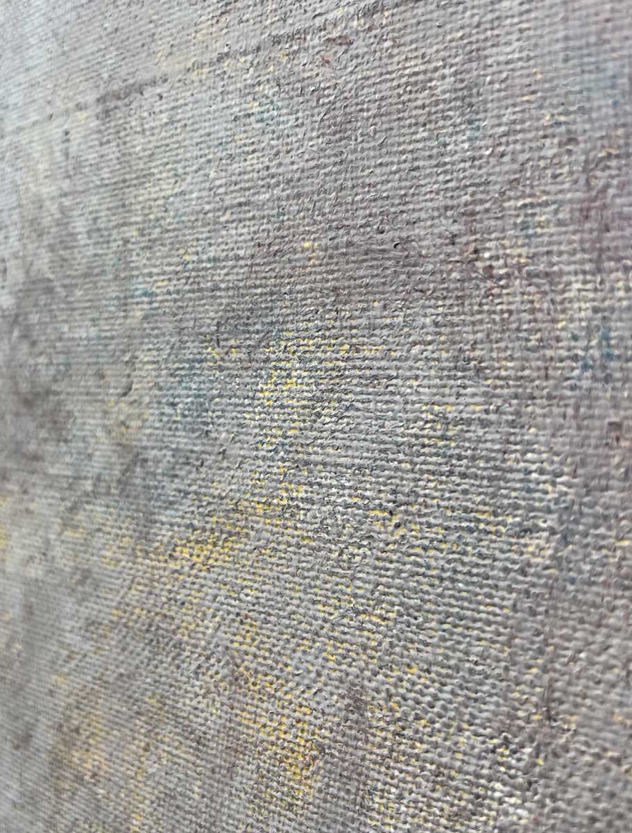 An up close detail of paint on canvas.
