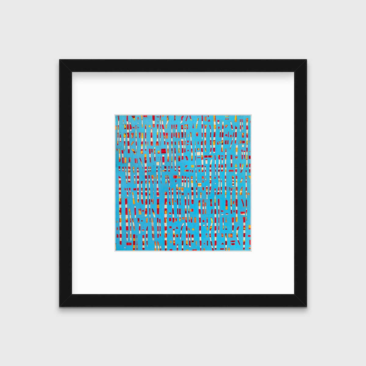A blue, red, yellow and white abstract print in a black frame with a mat hangs on a white wall.